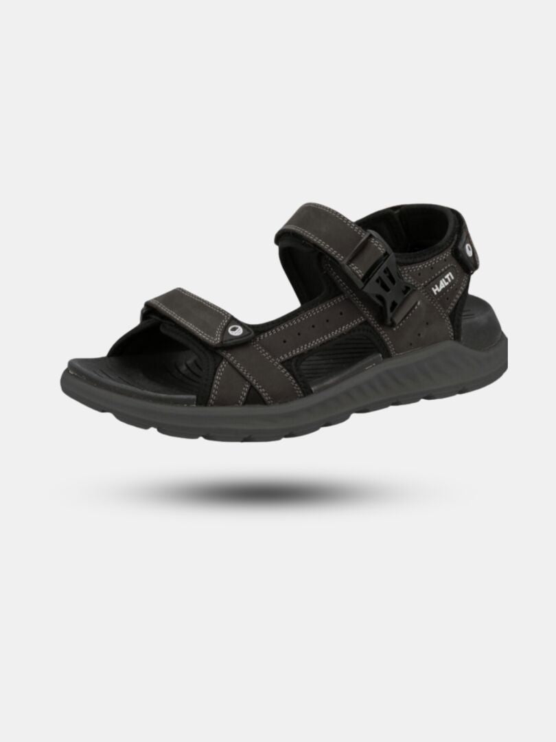 Halti Sora Sandaali on musta unisex-sandaali, jossa on säädettävät olkaimet ja nupukkinahka-viimeistely.