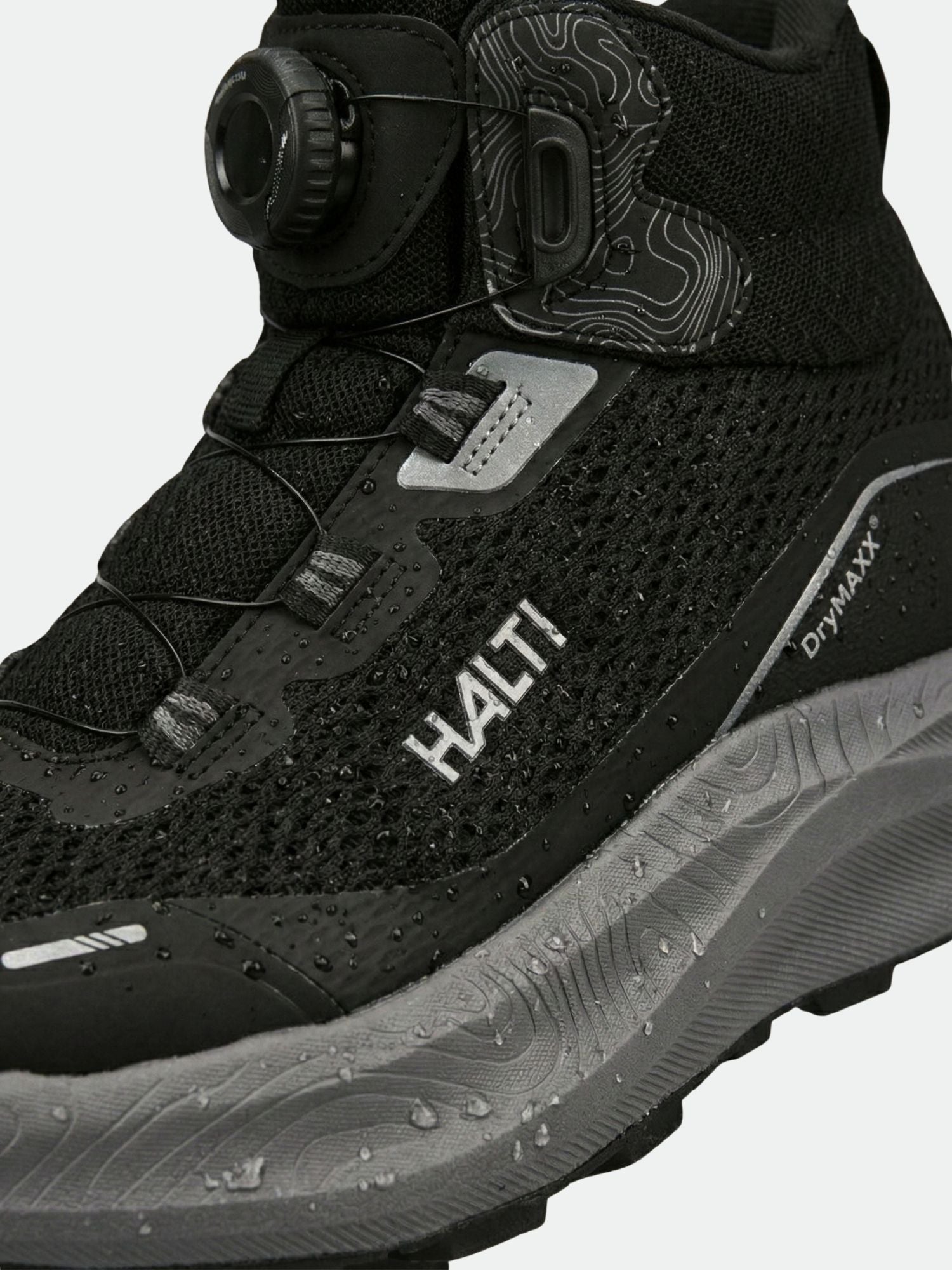 Lähikuva Halti Rapid Mid Freelock DX Ulkoilukenkä Unisex mustan/harmaan värinen Freelock-nauhoitus ja DrymaxX-kalvo.