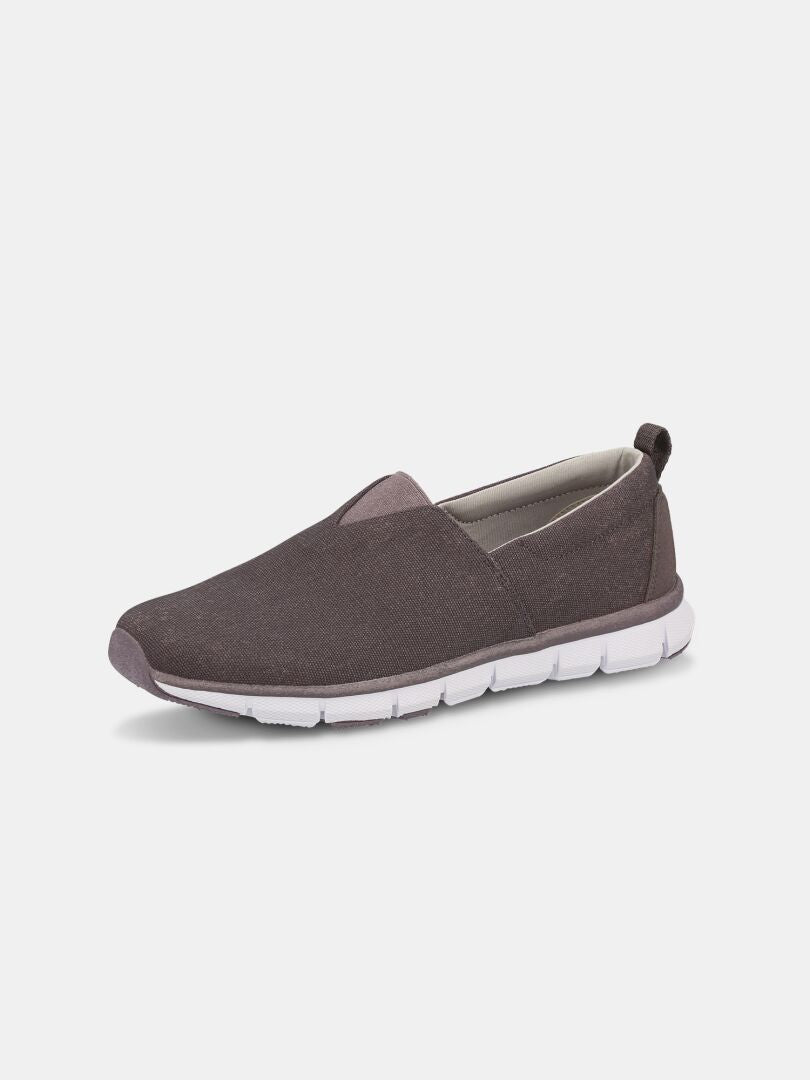 Halti Lente Canvas Kenkä Naisten tummanharmaa slip-on-kenkä, jossa on valkoinen segmentoitu pohja, kuvassa valkoinen.