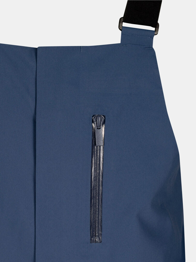 Lähikuva Halti Rizle 3L DX unisex-hiihtohousuista, siniset, joissa on pystysuora vetoketjutasku ja DrymaxX Nano -kangas.