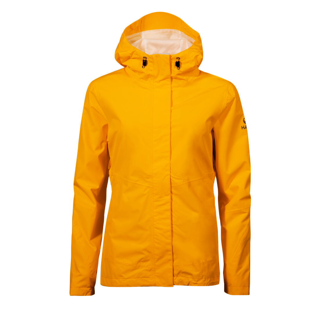 Halti Fort DX Kuoritakki Naisten on keltainen pitkähihainen takki, jossa on vetoketju edessä ja säädettävät kiristysnyörit hupussa.