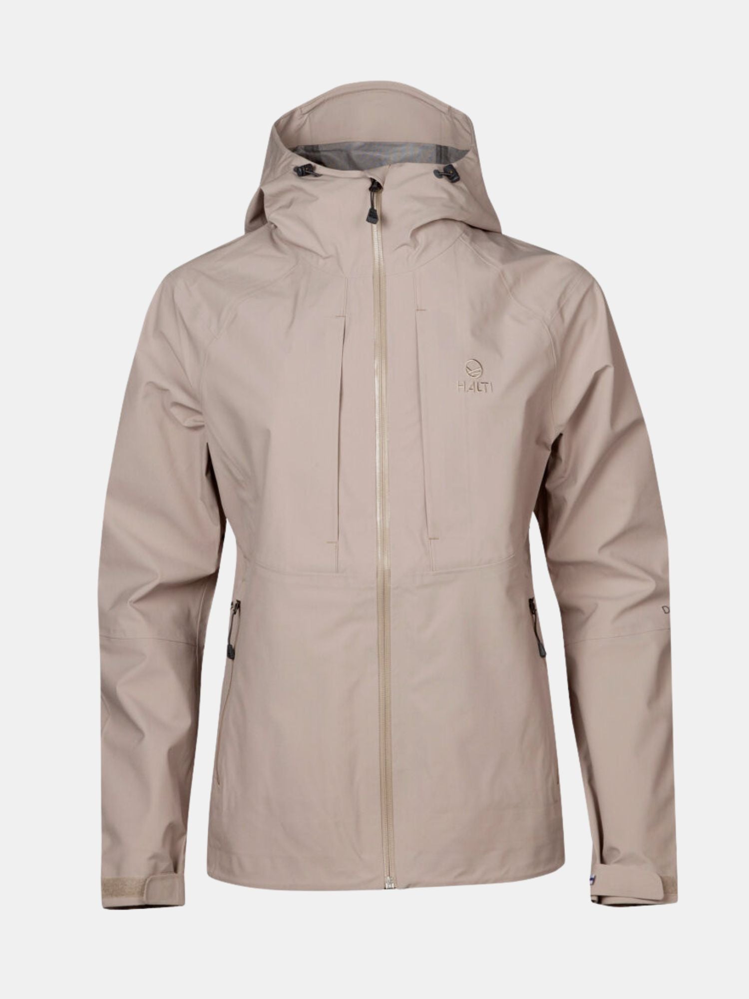 Halti Kaarna Naisten DX 3L Kuoritakki beige, jossa huppu, vetoketju edessä, vetoketjulliset rintataskut ja pitkät hihat.