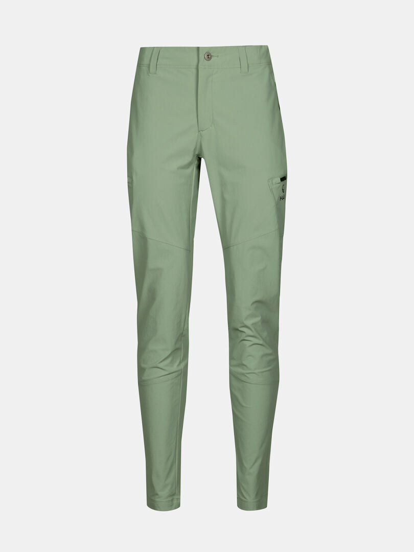 Vaaleanvihreät Halti Pallas Evo X-stretch -sukkahousut naisille, joissa on edessä napitus, vetoketju ja sivutaskut.