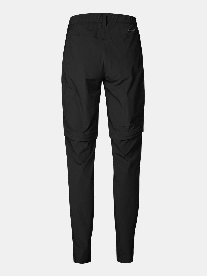 Halti Pallas Cool Stretch Zip-off Housut Naisten, kuvassa selkäpuolelta vaalealla pohjalla.