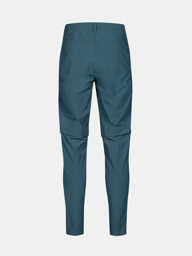 Takakuva Halti Pallas Cool Stretch Zip-off Housut Miesten tiilenpunaisesta, polvipituisella vetoketjulla varustetusta housusta valkoisella pohjalla.