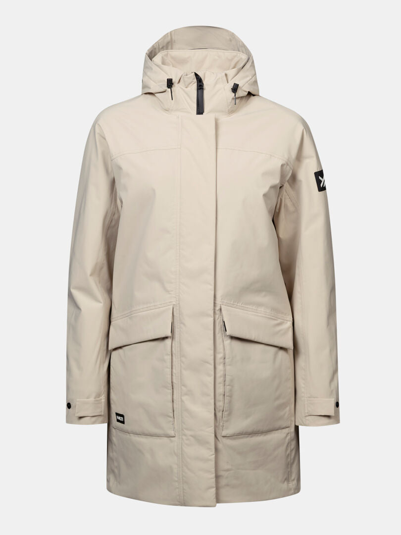 Halti Kortteli DX -parka naisille: beige, vetoketju edessä, painonapit, 2 taskua, musta hihamerkki.