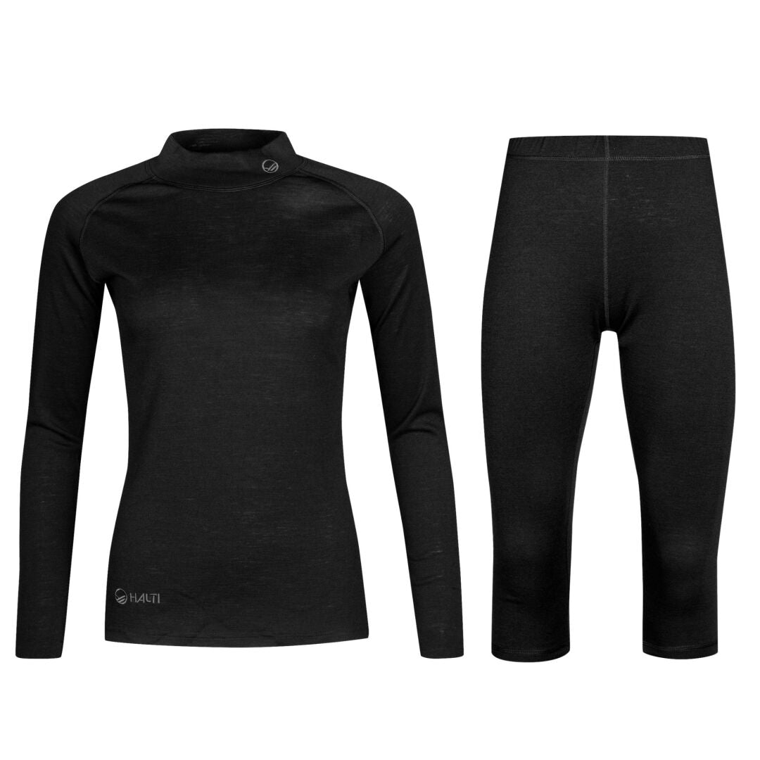 Halti Neva Merino 3/4 Kerrasto Naisten: musta pitkähihainen toppi ja 3/4 leggingsit aktiiviseen harjoitteluun.