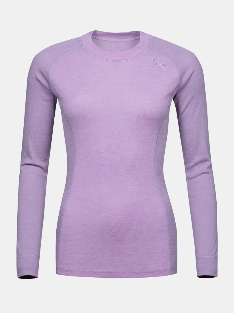 Halti Hossa II Merino Kerrasto Naisten: vartalonmyötäinen, pitkähihainen vaaleanvioletti naisten paita, jossa on hillitty logo olkapäässä.