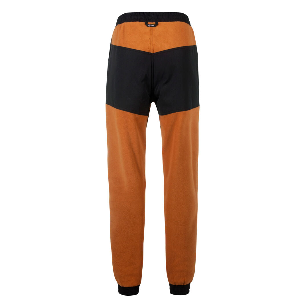 Halti Skugge Unisex Fleecehousut -takki takaa päin, ja siinä on oranssit lahkeet, musta vyötärönauha ja musta yläselkäpaneeli.