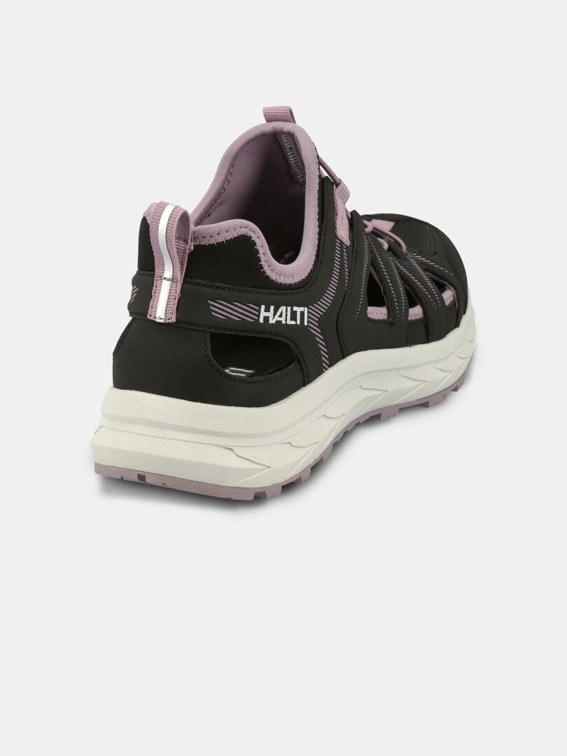 Halti Seili Hybrid Sandaali Naisten mustassa ja violetissa värissä on paksu valkoinen pohja, kuvattuna takasivukulmasta.