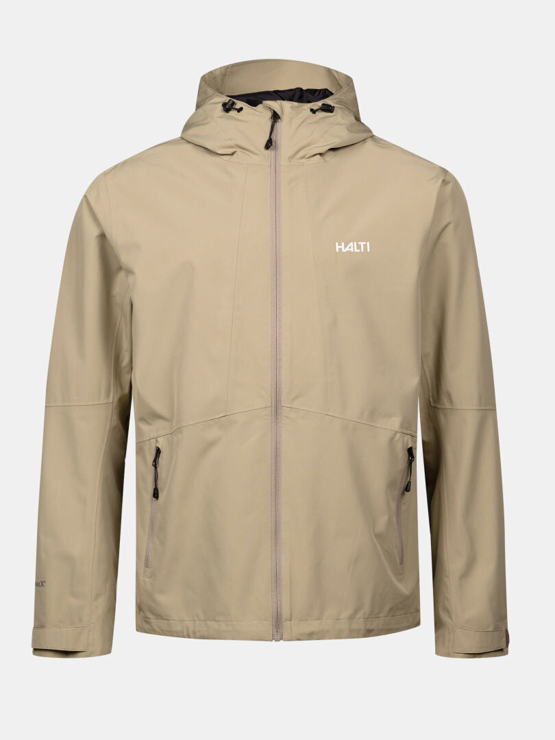 Halti Forter DX miesten kuoritakki, beige mustilla vetoketjuilla ja logolla, esillä yksivärisellä taustalla.