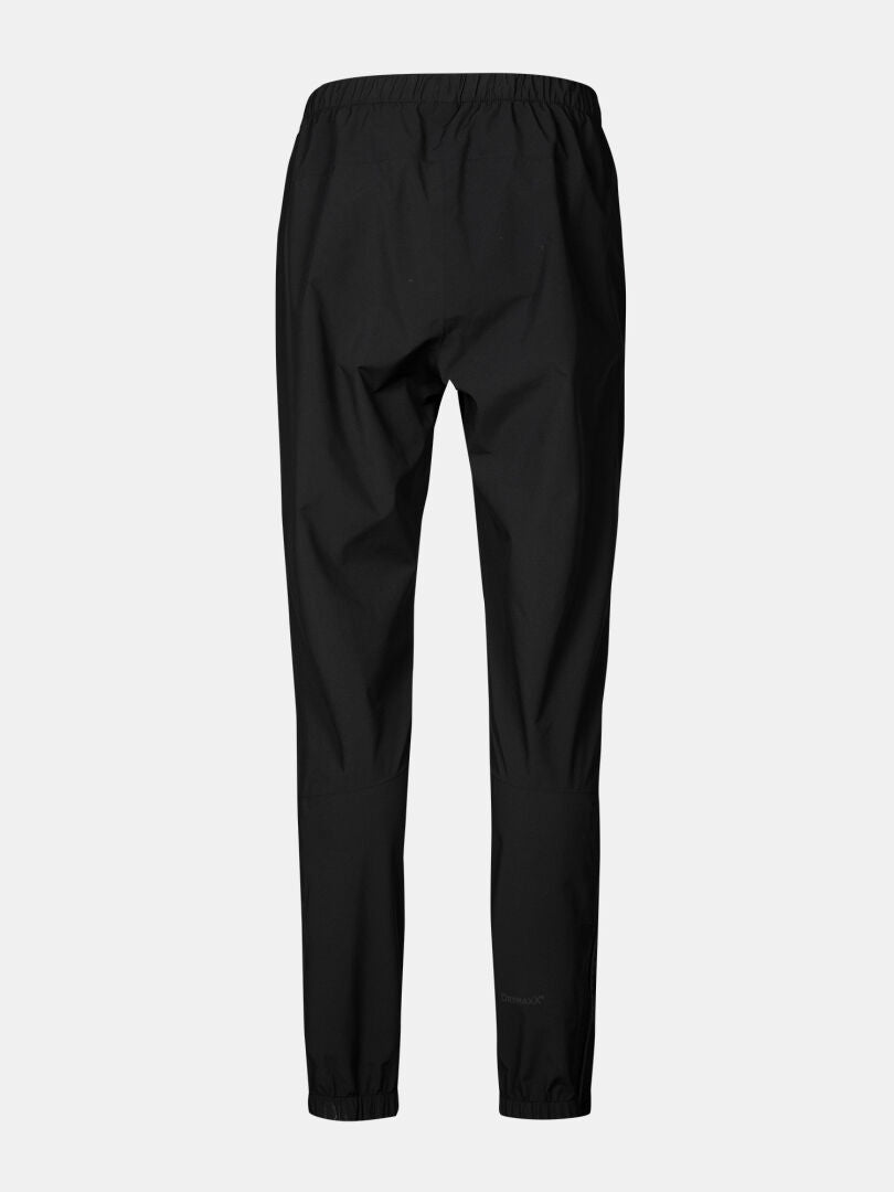 Halti Pisarat 2,5L DX Miesten kuorihousut, musta, elastinen vyötärö ja suorat lahkeet, taustakuva vaalea.