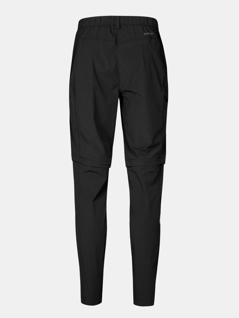 Halti Pallas Cool Stretch Vetoketjullinen housutakki, joustava vyötärö, suorat lahkeet; selkänäkymä yksivärisellä pohjalla.
